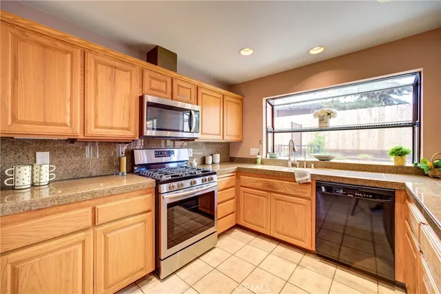 a bedroom with two beds and a window