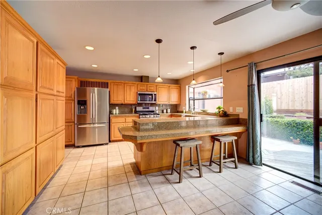 a bedroom with two beds and a chandelier