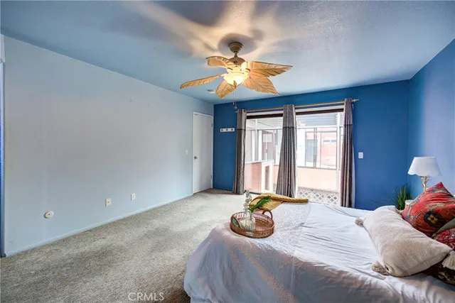a kitchen with stainless steel appliances granite countertop a sink window and cabinets