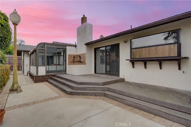 a bathroom with a sink toilet a mirror and shower