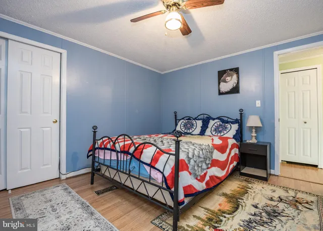 a bedroom with bed and window