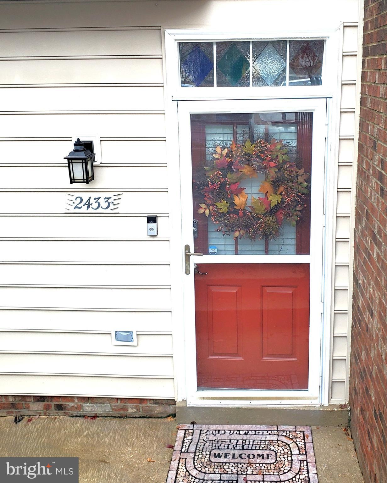 a view of door with wooden floor