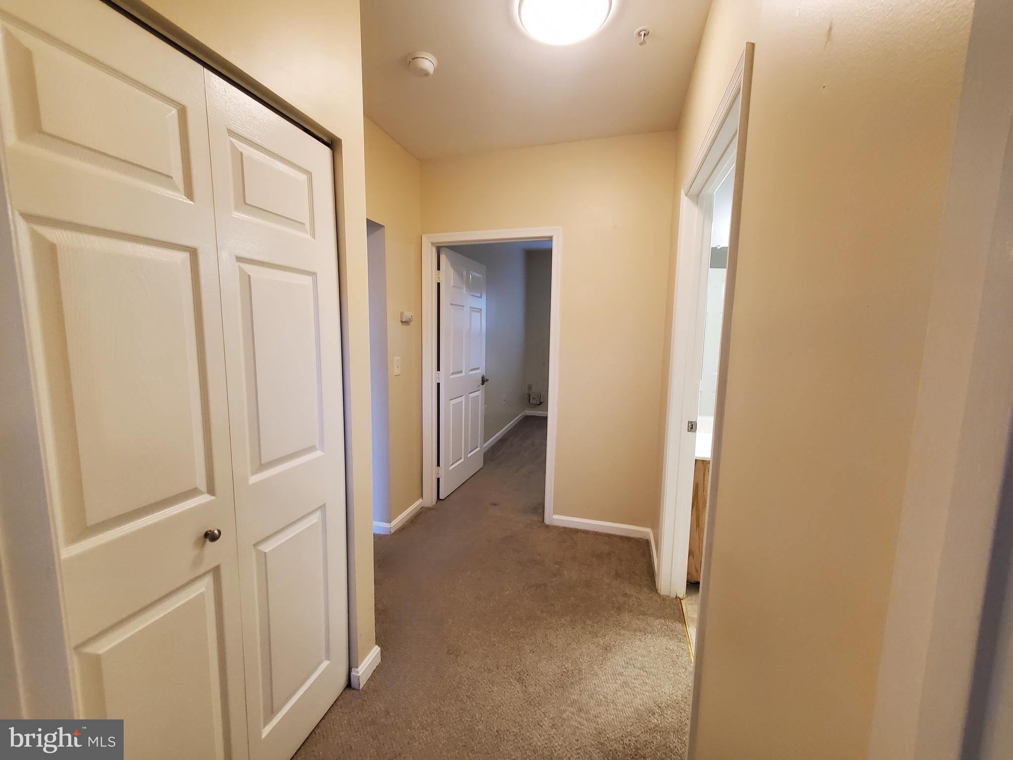 2433 Wentworth Drive Crofton, MD 21114 - Photo 15 of 18 a view of a hallway with wooden floor