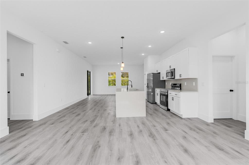 3428 Southwest 165th Loop Ocala, FL 34473 - Photo 14 of 43 a view of kitchen with wooden floor