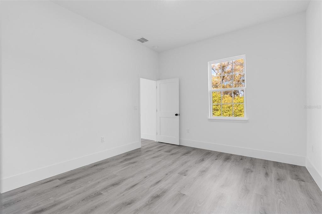 3428 Southwest 165th Loop Ocala, FL 34473 - Photo 23 of 43 an empty room with a window