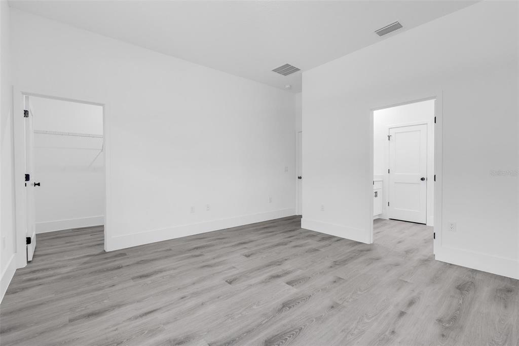 3428 Southwest 165th Loop Ocala, FL 34473 - Photo 24 of 43 an empty room with wooden floor