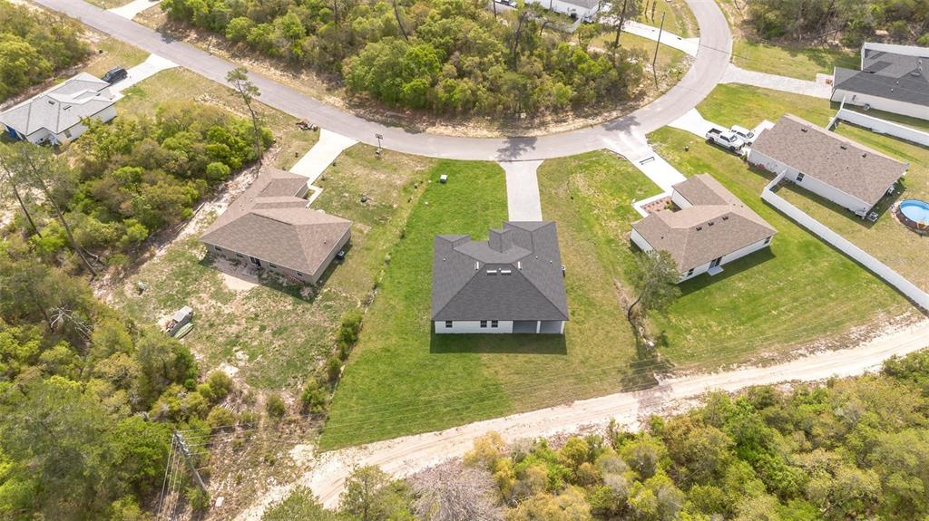 3428 Southwest 165th Loop Ocala, FL 34473 - Photo 42 of 43 an aerial view of a house with a yard