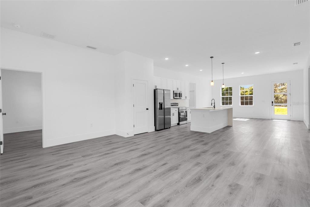 3428 Southwest 165th Loop Ocala, FL 34473 - Photo 6 of 43 a view of a kitchen with wooden floor