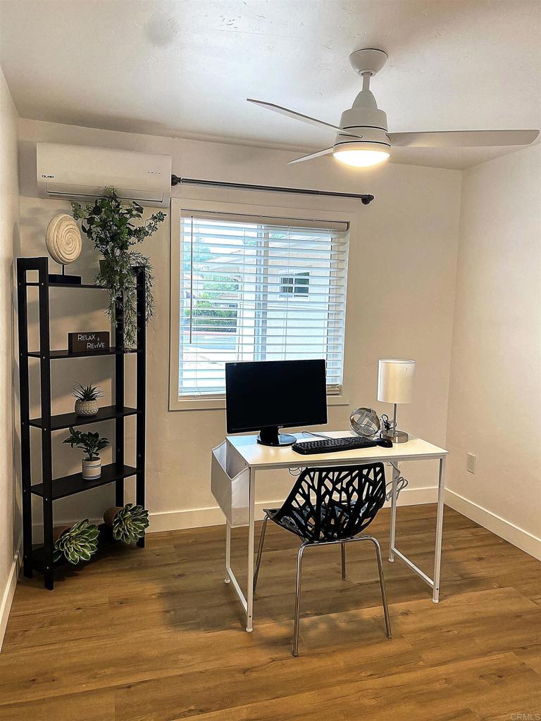 12401 Metate Lane Poway, CA 92064 - Photo 16 of 42 a view of a workspace with furniture and a window