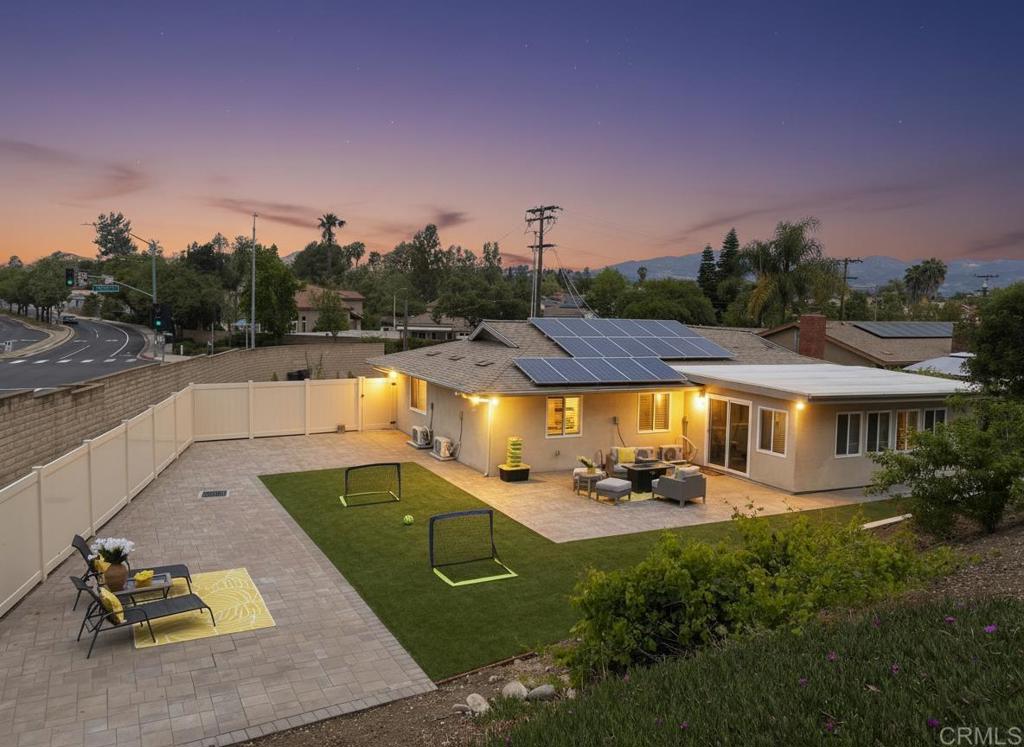 12401 Metate Lane Poway, CA 92064 - Photo 2 of 42 a view of a swimming pool and lounge chairs in patio