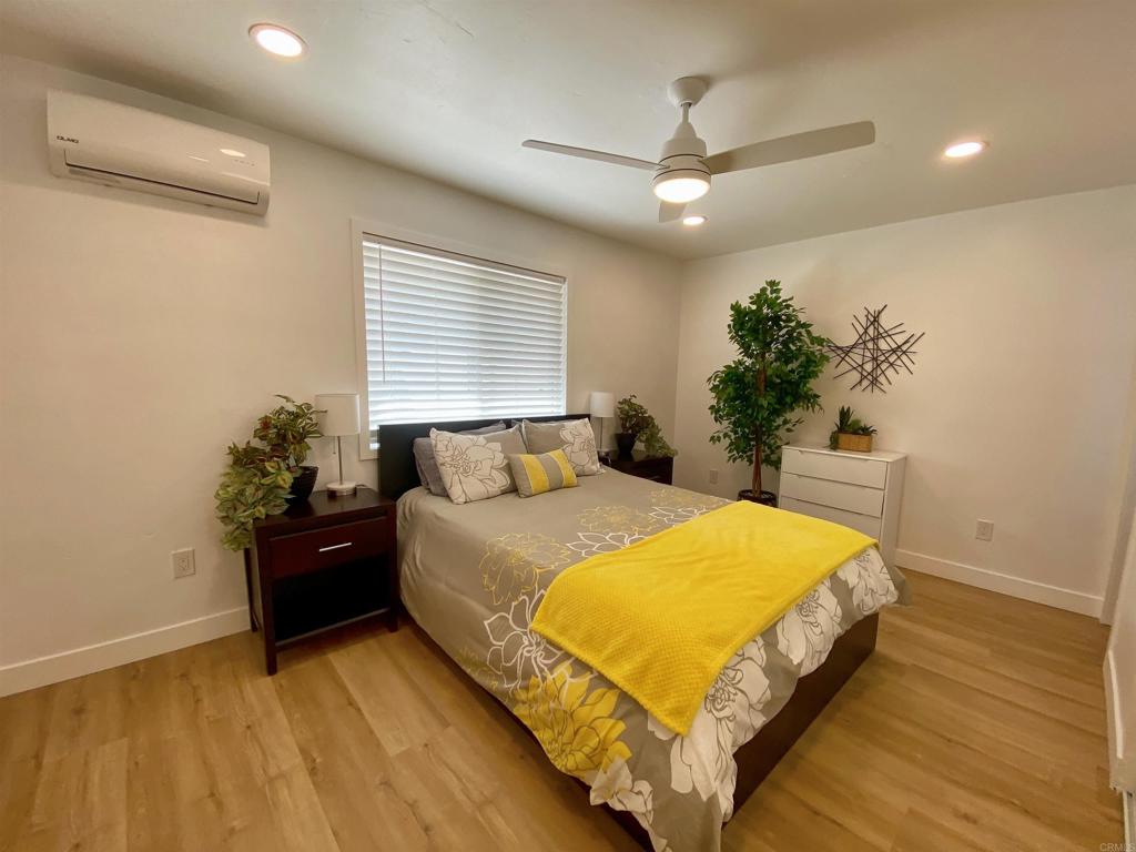 12401 Metate Lane Poway, CA 92064 - Photo 21 of 42 a bedroom with a bed and window