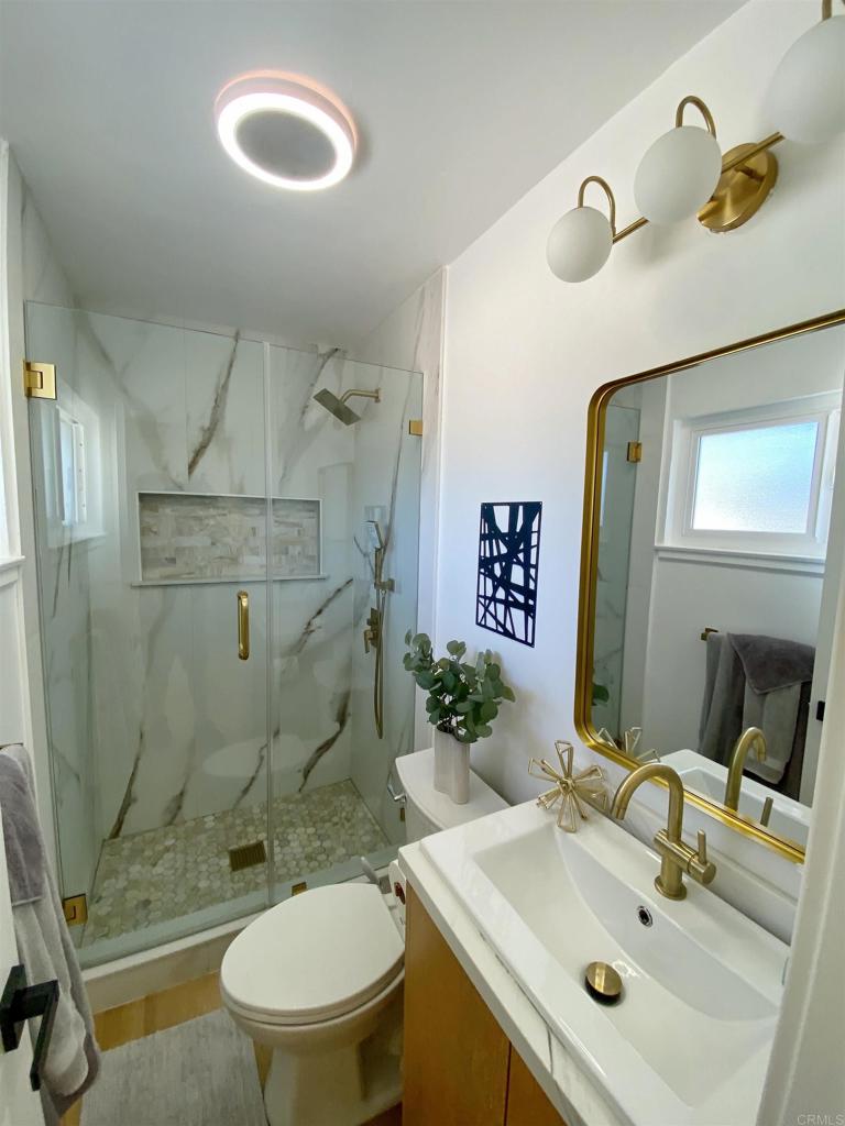 12401 Metate Lane Poway, CA 92064 - Photo 24 of 42 a bathroom with a sink toilet and shower