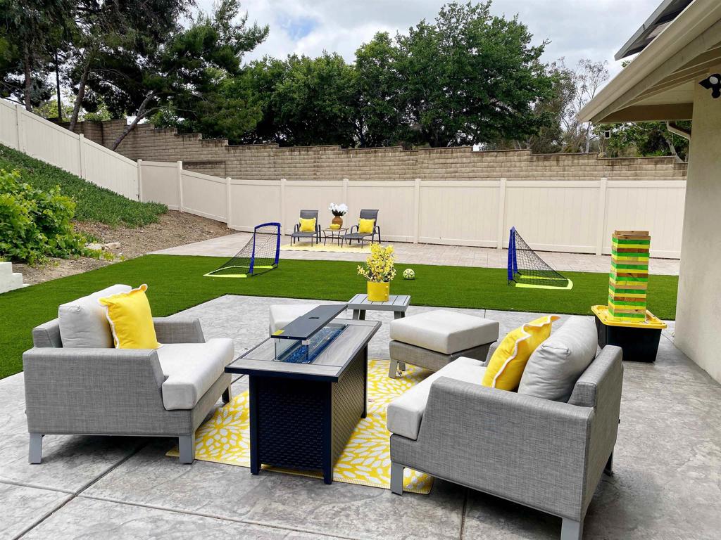 12401 Metate Lane Poway, CA 92064 - Photo 25 of 42 a view of outdoor sitting area with a couch and swing