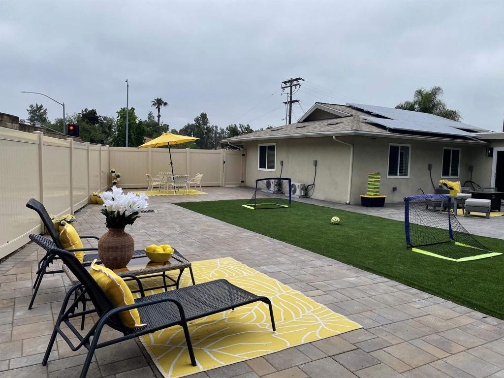 12401 Metate Lane Poway, CA 92064 - Photo 26 of 42 a view of a backyard with sitting area