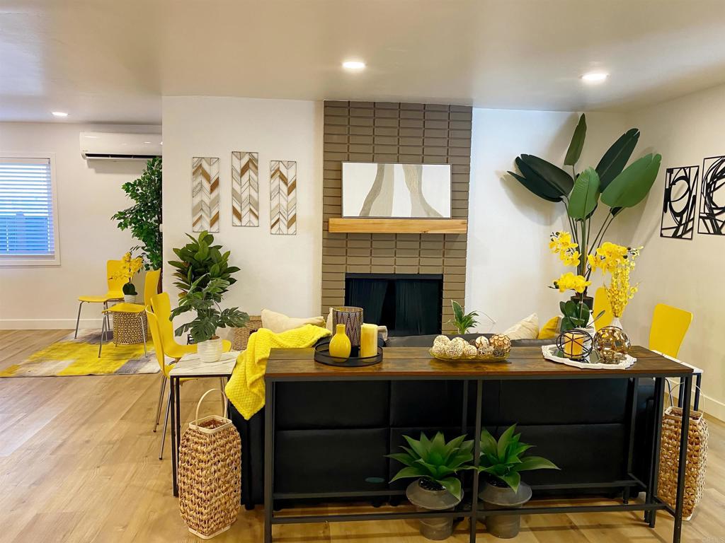12401 Metate Lane Poway, CA 92064 - Photo 4 of 42 a living room with furniture potted plant and a fireplace