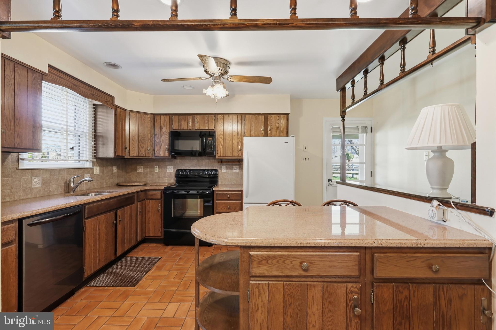 2015 Spring Mill Road Conshohocken, PA 19428 - Photo 13 of 39 a kitchen with stainless steel appliances granite countertop a sink and cabinets