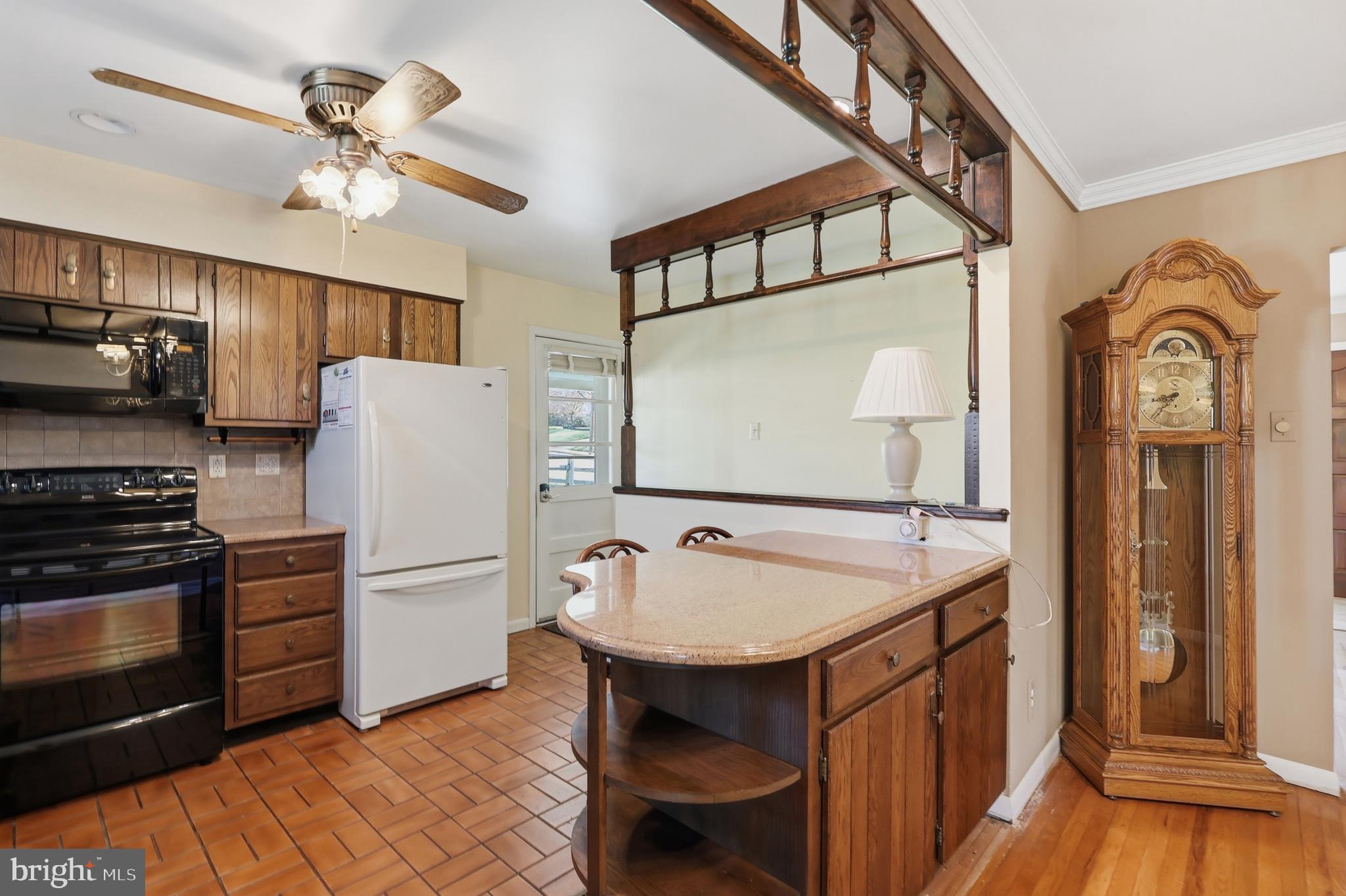 2015 Spring Mill Road Conshohocken, PA 19428 - Photo 14 of 39 a kitchen with sink a refrigerator and a stove top oven