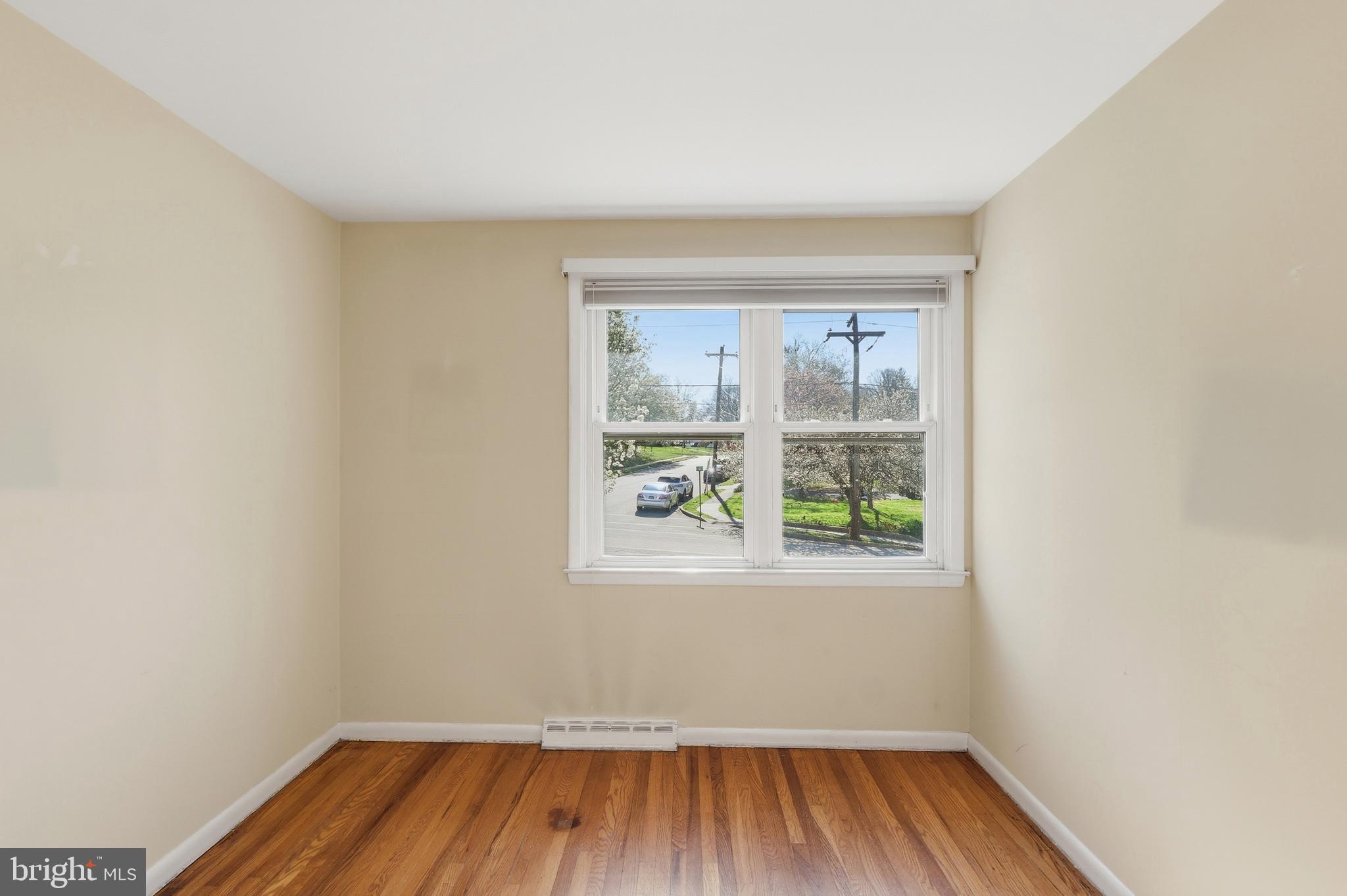 2015 Spring Mill Road Conshohocken, PA 19428 - Photo 16 of 39 an empty room with wooden floor and windows