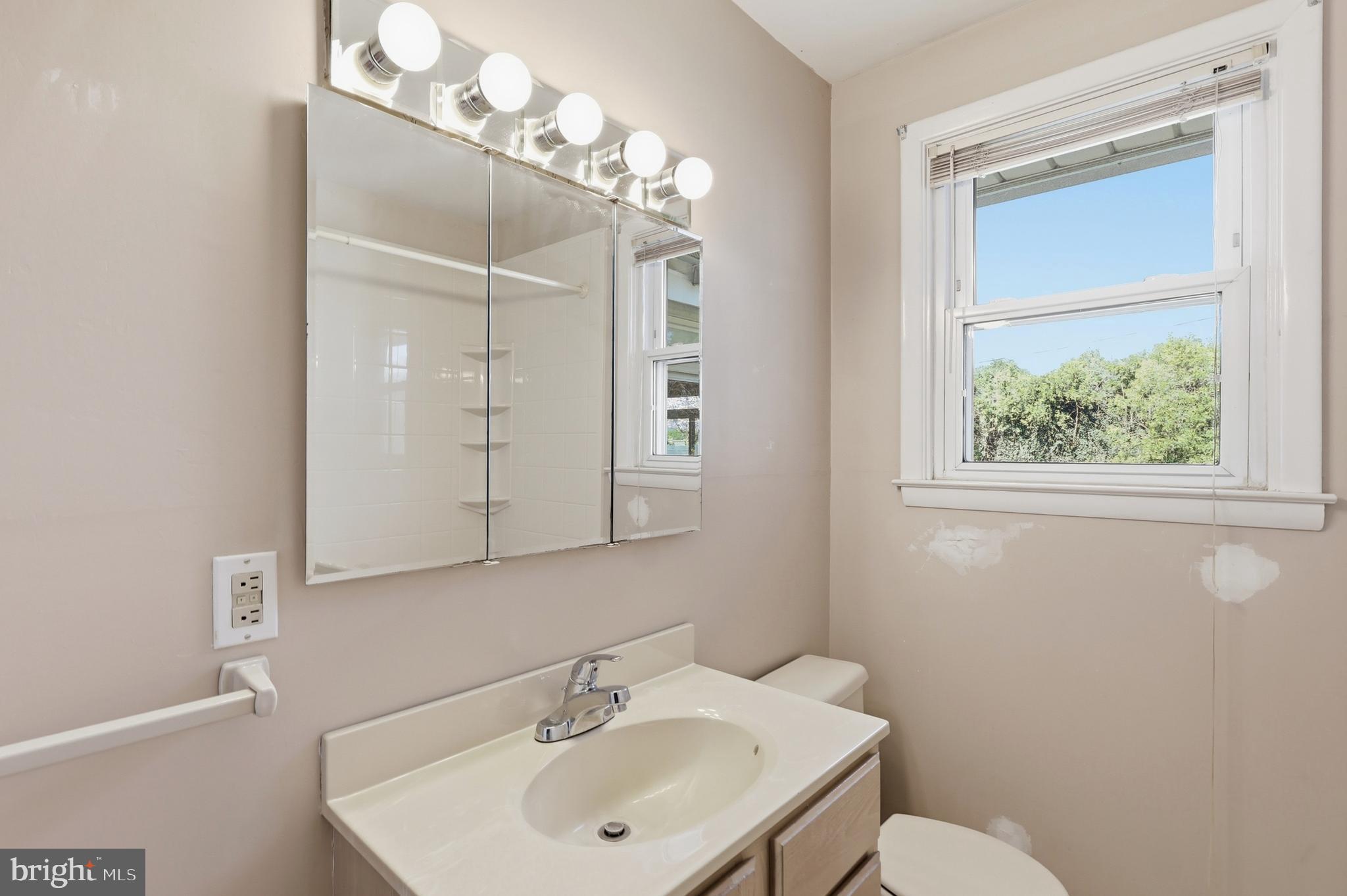 2015 Spring Mill Road Conshohocken, PA 19428 - Photo 22 of 39 a bathroom with a sink mirror and a toilet