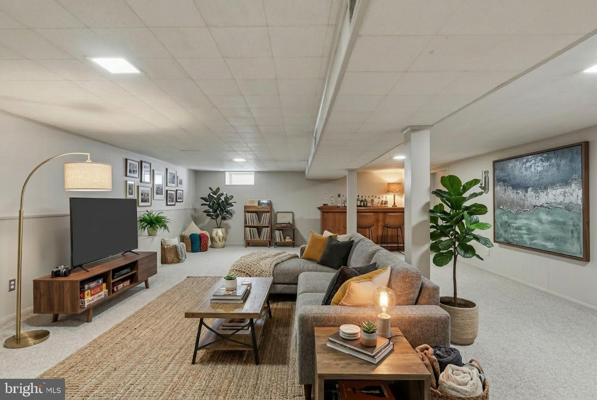 2015 Spring Mill Road Conshohocken, PA 19428 - Photo 26 of 39 a living room with furniture a chandelier and a flat screen tv