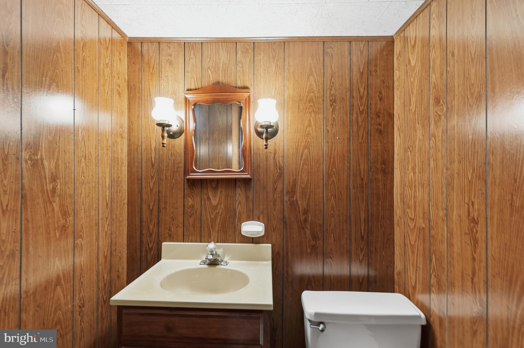 2015 Spring Mill Road Conshohocken, PA 19428 - Photo 28 of 39 a bathroom with a sink a toilet and mirror