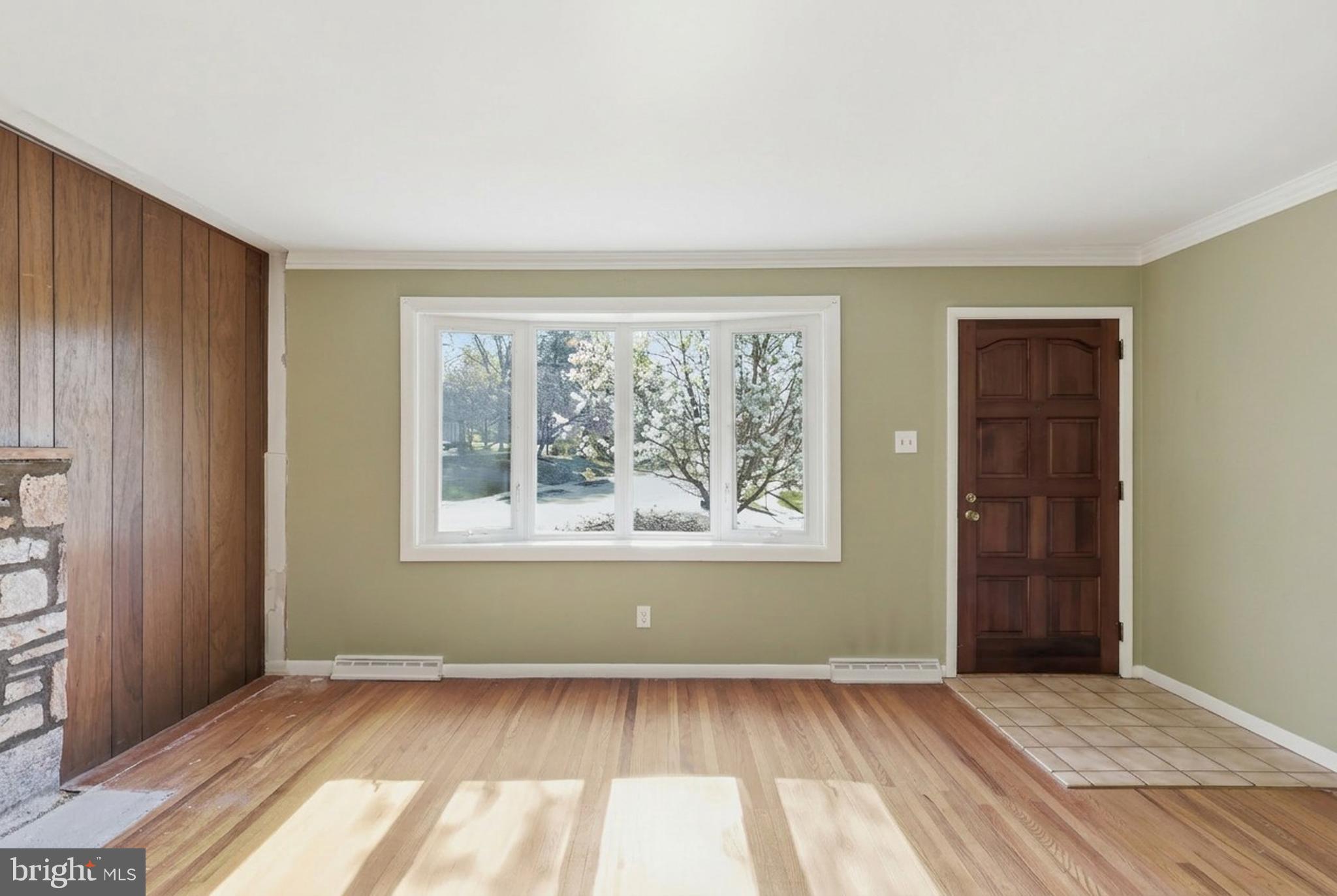 2015 Spring Mill Road Conshohocken, PA 19428 - Photo 8 of 39 an empty room with wooden floor and windows