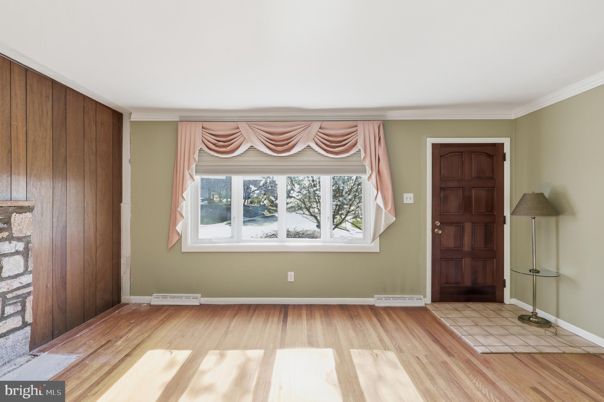 2015 Spring Mill Road Conshohocken, PA 19428 - Photo 9 of 39 an empty room with wooden floor and a window