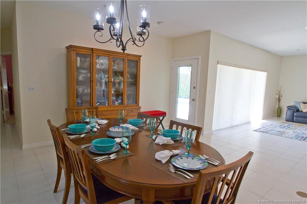 1790 Northwest River Trail Stuart, FL 34994 - Photo 11 of 44 a view of a dining room with furniture window and wooden floor
