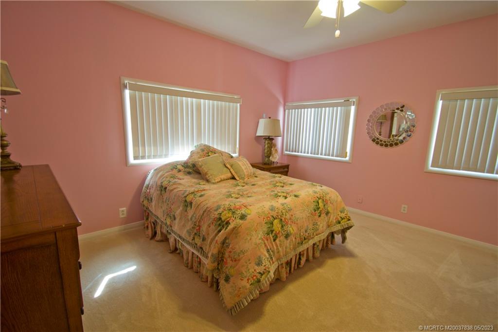1790 Northwest River Trail Stuart, FL 34994 - Photo 26 of 44 a bedroom with a bed and a window