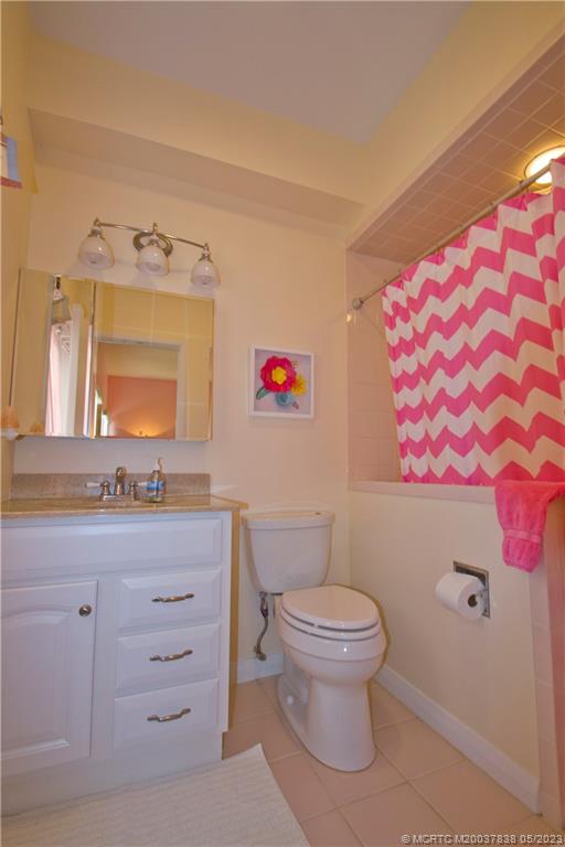 1790 Northwest River Trail Stuart, FL 34994 - Photo 27 of 44 a bathroom with a toilet a sink and a mirror