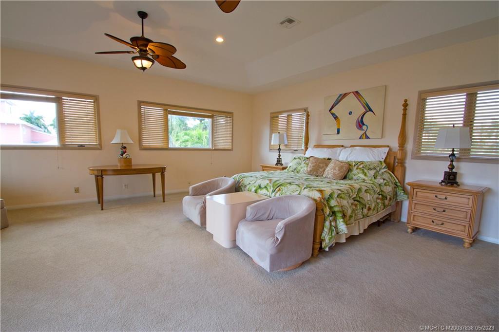 1790 Northwest River Trail Stuart, FL 34994 - Photo 28 of 44 a bedroom with a bed and a table