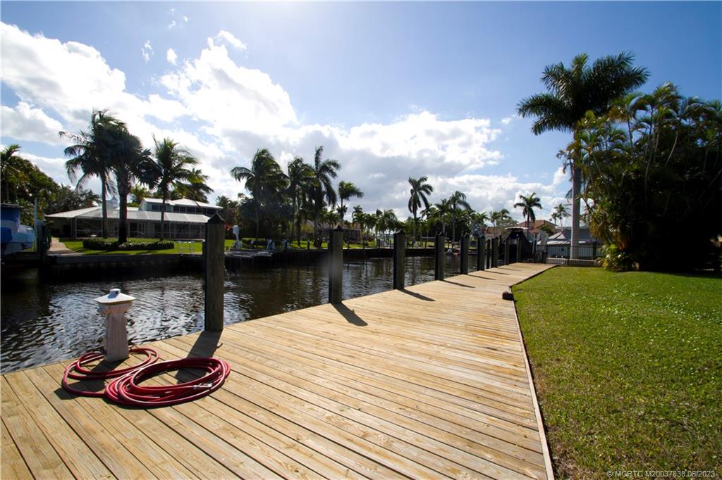 1790 Northwest River Trail Stuart, FL 34994 - Photo 3 of 44 a lake view with a fountain