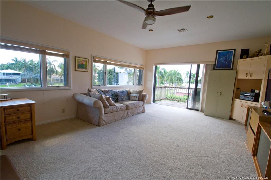 1790 Northwest River Trail Stuart, FL 34994 - Photo 37 of 44 a living room with furniture and a flat screen tv