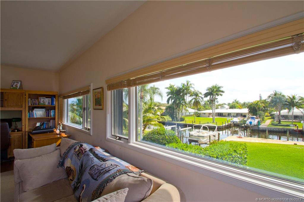 1790 Northwest River Trail Stuart, FL 34994 - Photo 38 of 44 a living room with couch and a large window with garden view