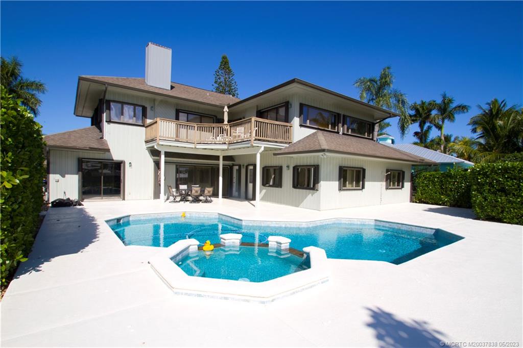 1790 Northwest River Trail Stuart, FL 34994 - Photo 44 of 44 a front view of a house with a yard table and chairs