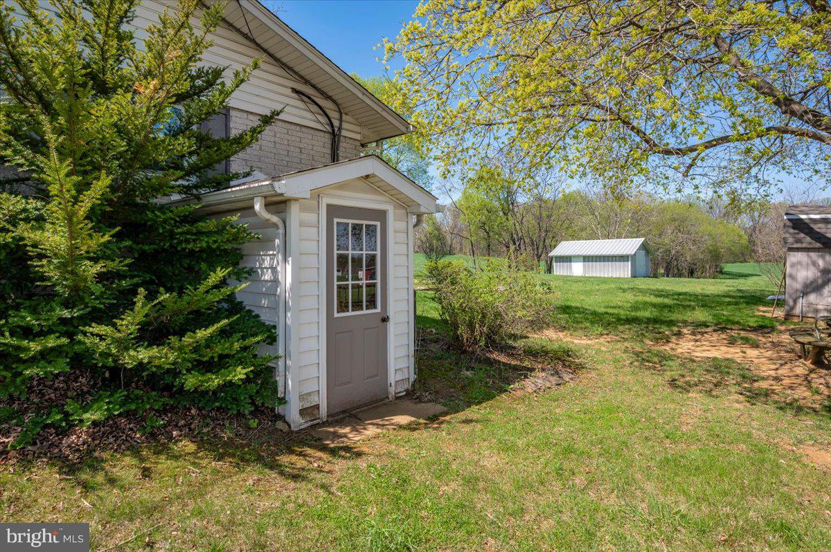 5536 Catholic Church Road Jefferson, MD 21755 - Photo 63 of 67 Walkup stairs from basement to side yard.