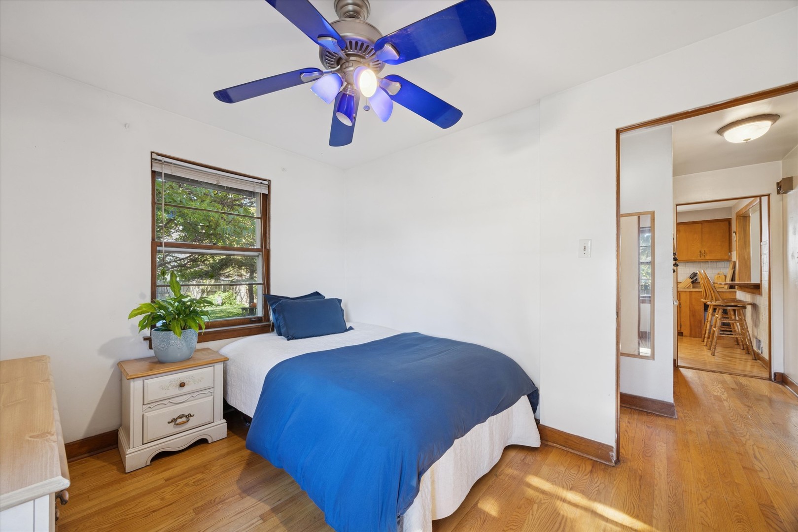 3334 Prairie Avenue Brookfield, IL 60513 - Photo 11 of 18 a bedroom with a bed and wooden floor