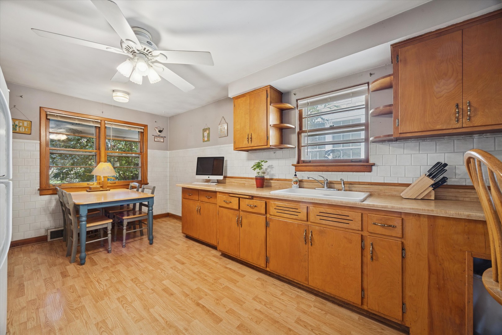3334 Prairie Avenue Brookfield, IL 60513 - Photo 5 of 18 a kitchen with a sink cabinets and dining table chair