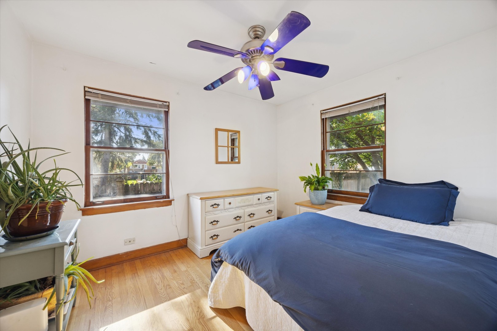 3334 Prairie Avenue Brookfield, IL 60513 - Photo 10 of 18 a bedroom with a bed and a chandelier