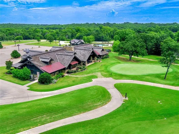 a view of a swimming pool with an outdoor space and seating area