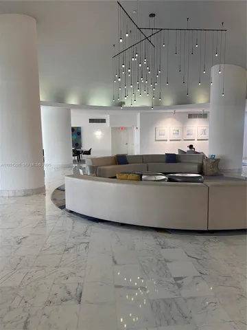 a view of backyard with swimming pool and furniture