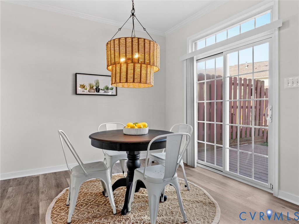 9524 Spring Moss Terrace, Unit 9524 Glen Allen, VA 23060 - Photo 13 of 41 a view of a dining room with furniture and chandelier