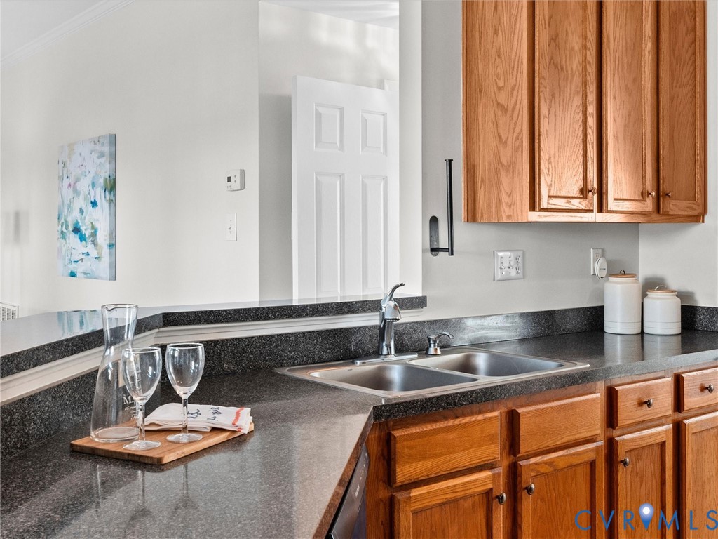 9524 Spring Moss Terrace, Unit 9524 Glen Allen, VA 23060 - Photo 16 of 41 a kitchen with a sink and cabinets