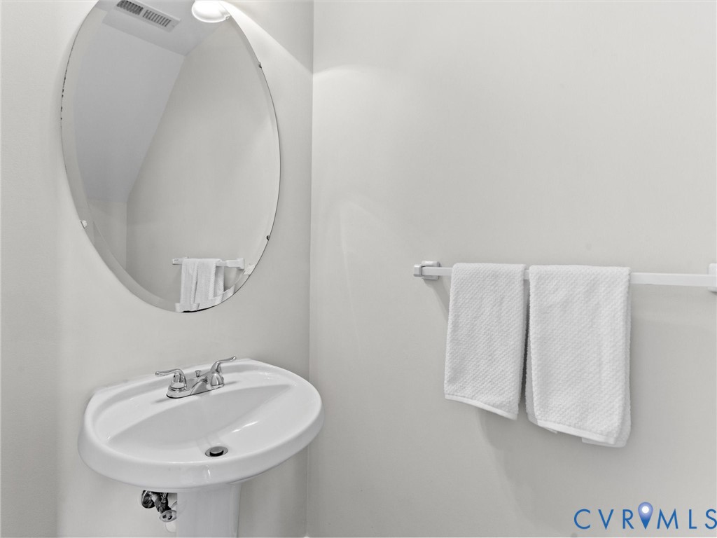 9524 Spring Moss Terrace, Unit 9524 Glen Allen, VA 23060 - Photo 20 of 41 a bathroom with a sink and a mirror
