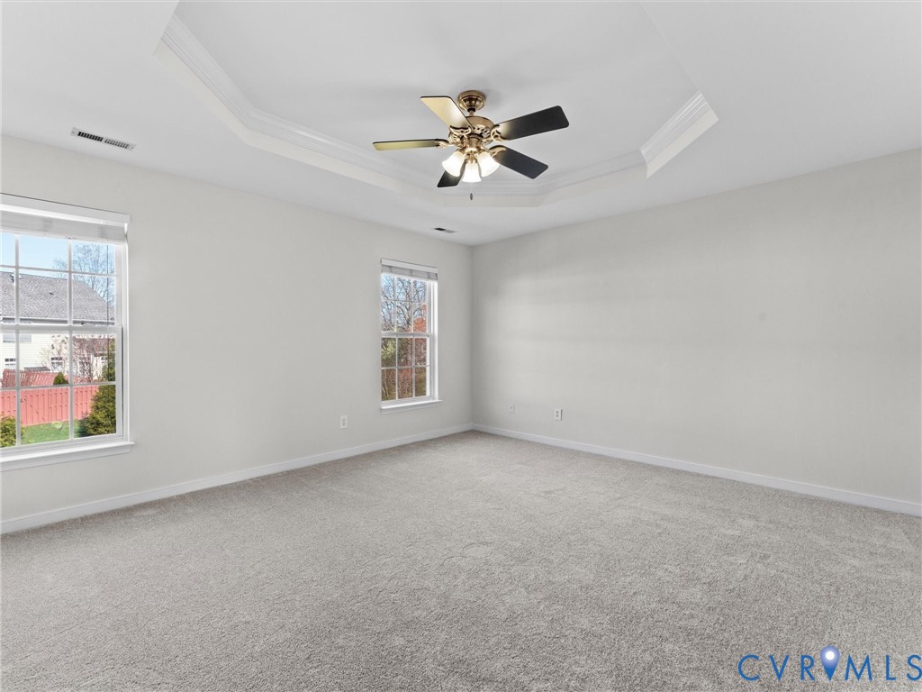 9524 Spring Moss Terrace, Unit 9524 Glen Allen, VA 23060 - Photo 21 of 41 an empty room with windows and fan
