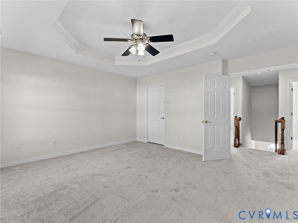 9524 Spring Moss Terrace, Unit 9524 Glen Allen, VA 23060 - Photo 24 of 41 an empty room with chandelier fan