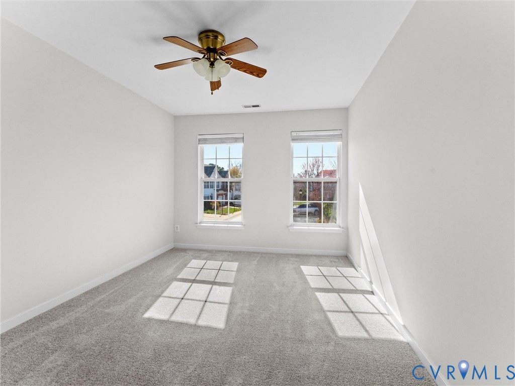 9524 Spring Moss Terrace, Unit 9524 Glen Allen, VA 23060 - Photo 30 of 41 an empty room with windows and fan
