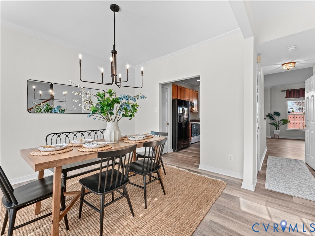 9524 Spring Moss Terrace, Unit 9524 Glen Allen, VA 23060 - Photo 3 of 41 a table and chairs in a room