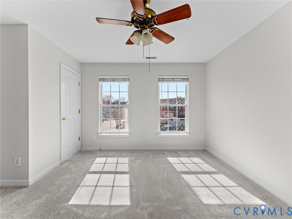 9524 Spring Moss Terrace, Unit 9524 Glen Allen, VA 23060 - Photo 33 of 41 a view of windows and chandelier in a room