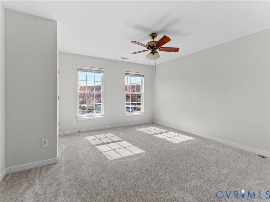 9524 Spring Moss Terrace, Unit 9524 Glen Allen, VA 23060 - Photo 34 of 41 wooden floor in an empty room with a window